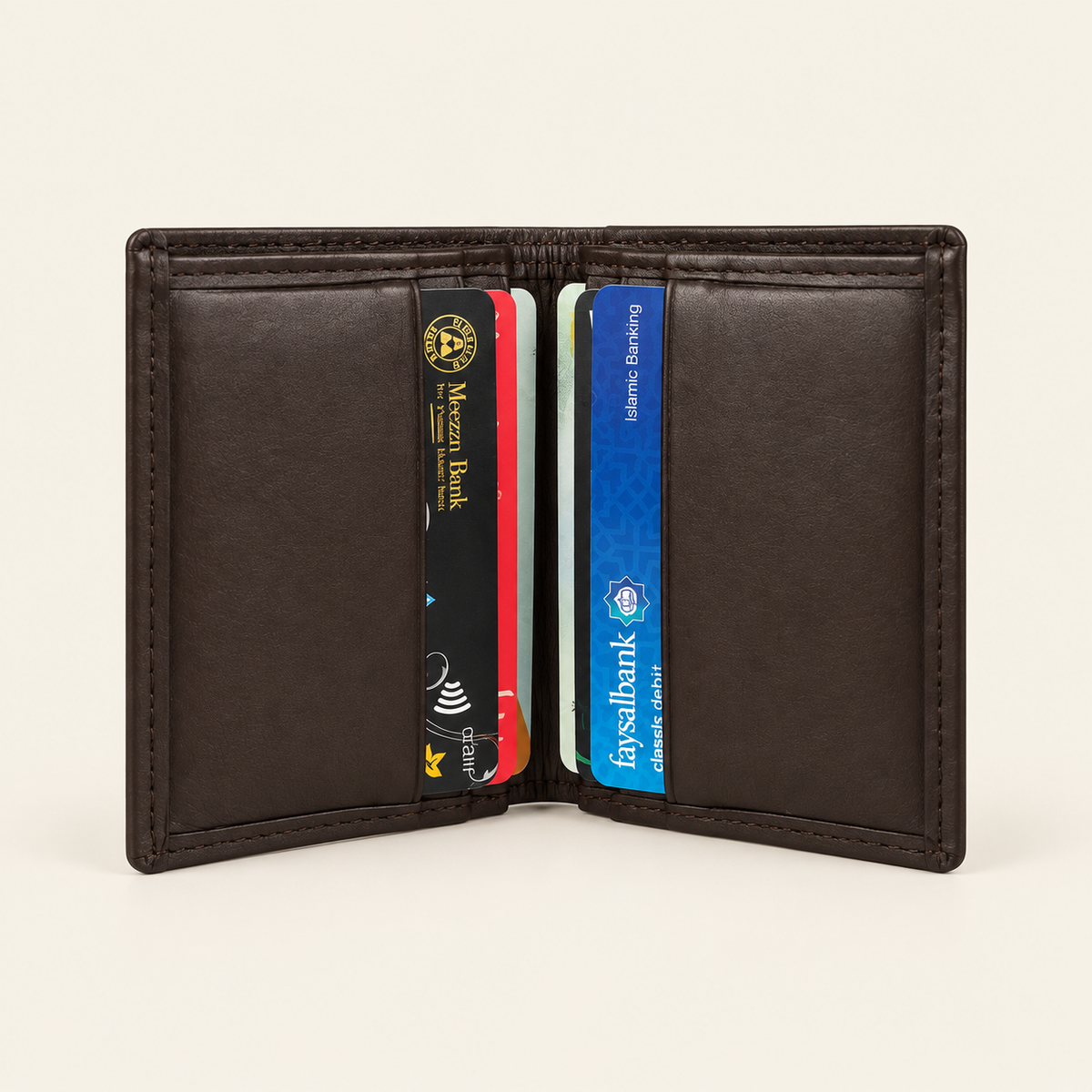 Atelier dark brown compact card holder — shown with cards